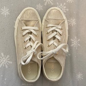 Tan and gold sparkly converse.